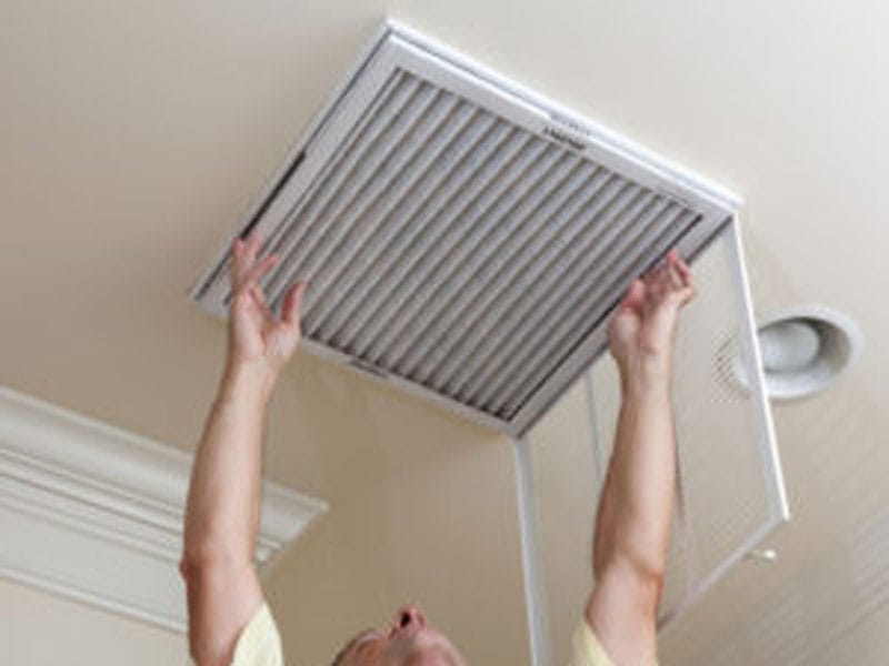 man changing filter